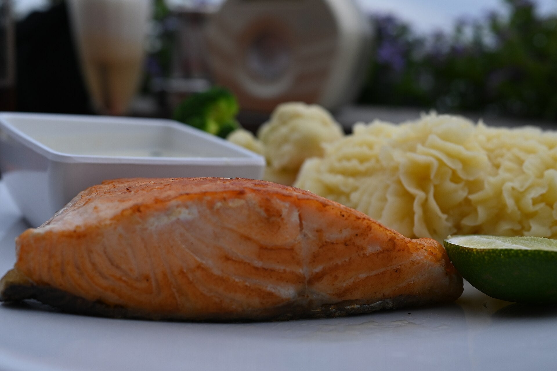 Cooked salmon fillet served with mashed potatoes and vegetables