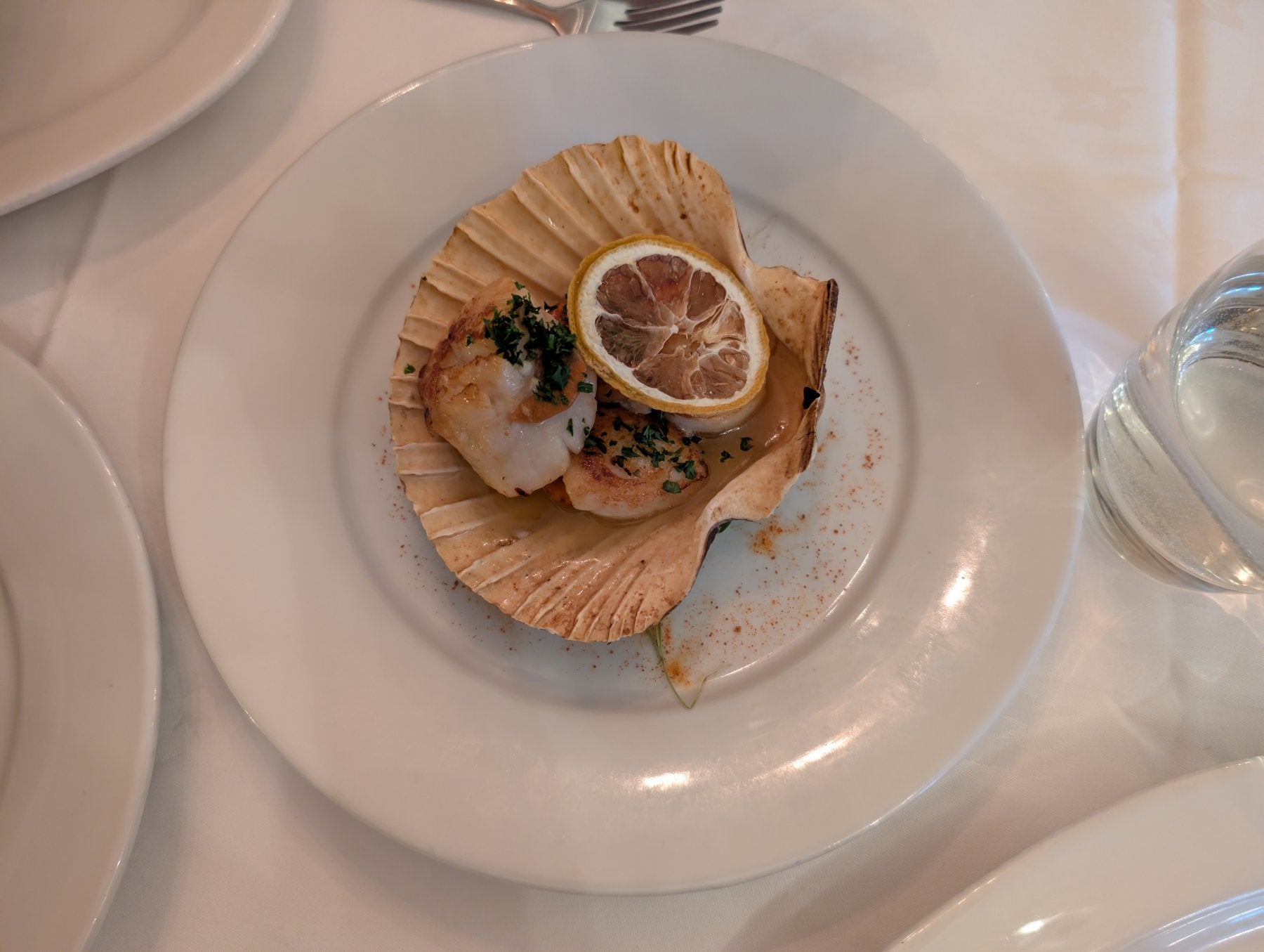 King scallop baked in its shell with butter and lemon