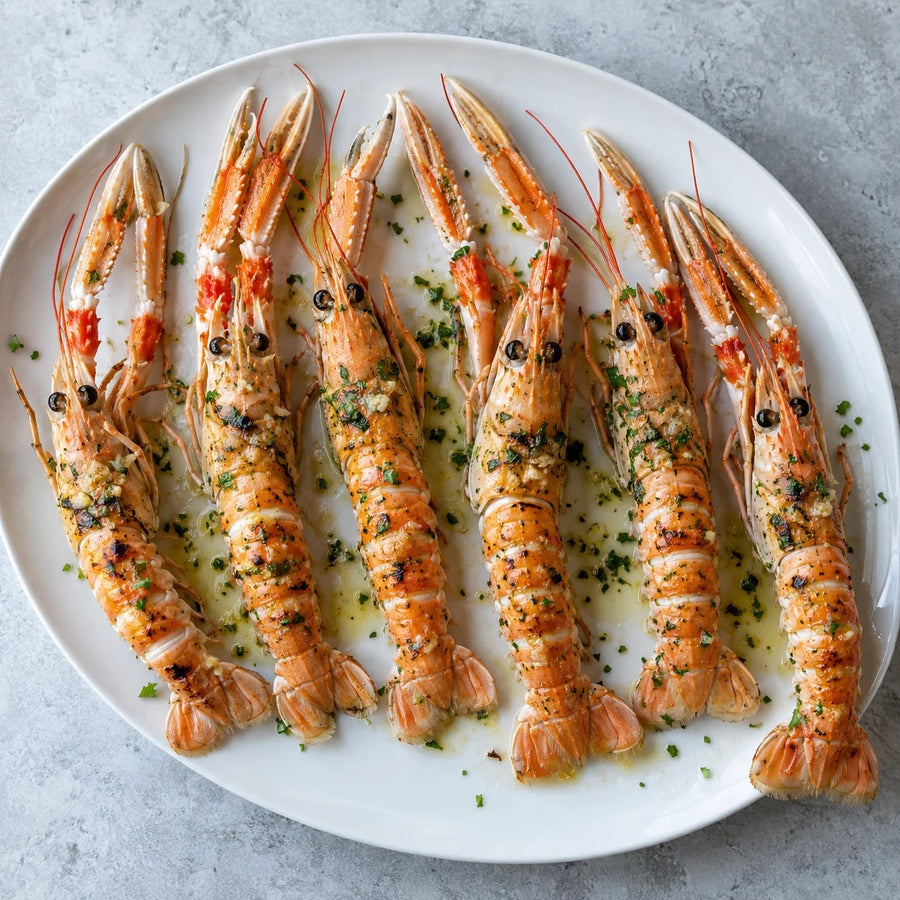 Six whole langoustines split and grilled in the shell with garlic butter and chives