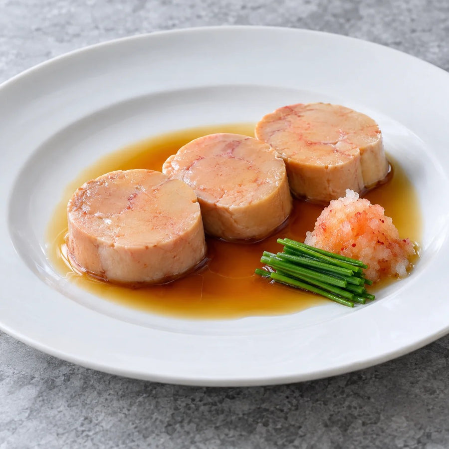 Three slices of monkfish liver in ponzu with chives and grated radish